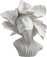 Bronze bust of a woman with flower petals for hair, in white