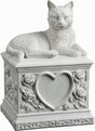 A white cat cremation urn featuring a detailed cat figurine resting on a square pedestal decorated with a central heart-shaped recess and embossed floral rose motifs.
