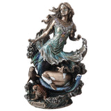 Statue of a mermaid goddess with whale, seal and walrus, and the name 'Sedna' 