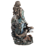 Statue of a mermaid goddess with whale, seal and walrus, shown from the side