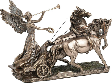 Faux Bronze statue of Greek goddess Nike on chariot pulled by two horses, blowing a trumpet