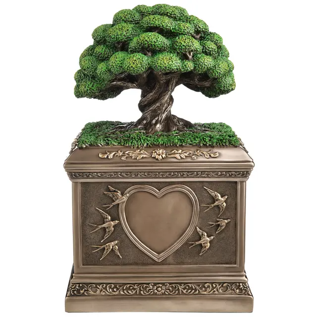 Bronze-hued urn with Tree of Life on top. Heart and swallows along the sides