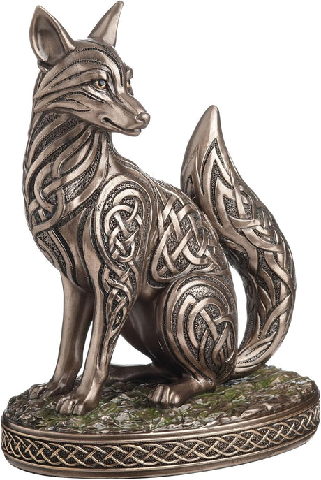 Bronze fox figurine with intricate Celtic knot patterns on a white background