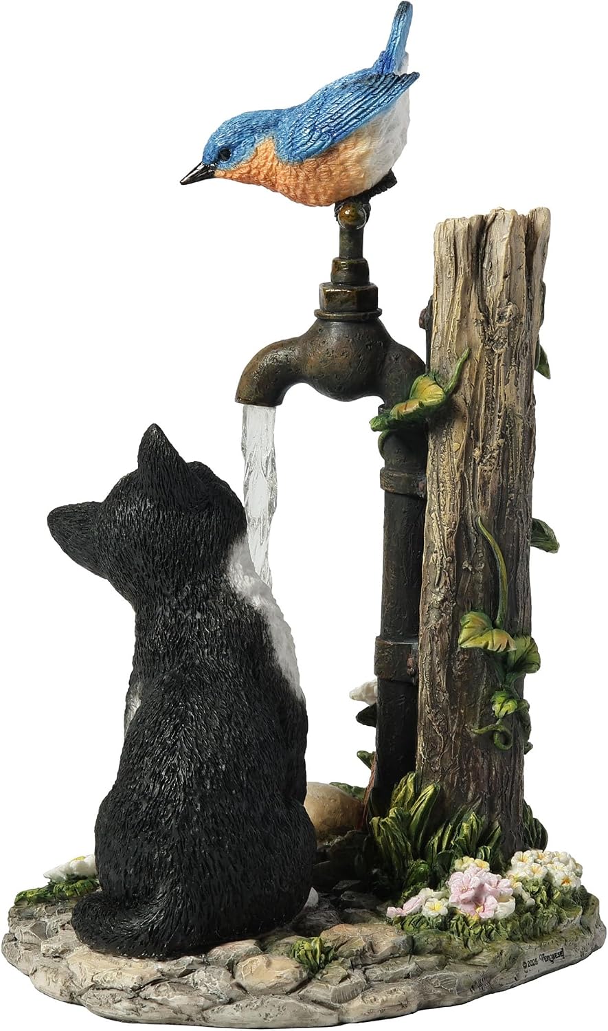 Figurine of cat drinking from garden faucet with bluebird perched on spigot