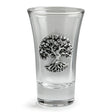 A clear glass shot glass featuring a detailed pewter tree of life emblem