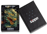 Zippo lighter with dragon design in packaging next to Zippo logo on black box