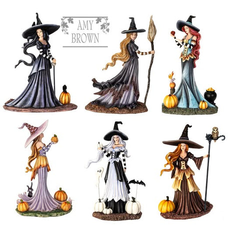 Set of witch figurines with different hairstyles and outfits on a white background, featuring the artist 'Amy Brown'.