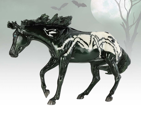 Black and white horse figurine with a ghostly background, spider pattern