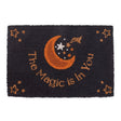 Black doormat with orange moon and stars design and 'The Magic is in You' text.