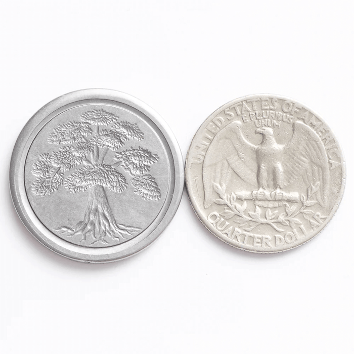 Tree wax coin seal, with quarter for size scale