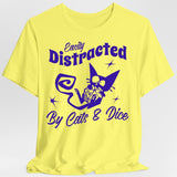 Yellow t-shirt with purple graphic and text 'Easily Distracted By Cats & Dice' on a light gray background