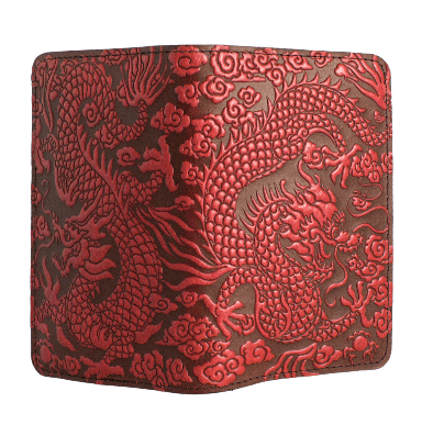 Leather pocket notebook cover with all-over design of Chinese dragon in the clouds.  Shown open from the back to display all-over design, in red