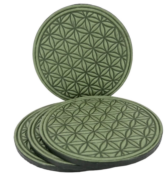 Set of 4 leather coasters in Flower of Life repeating design, shown in fern