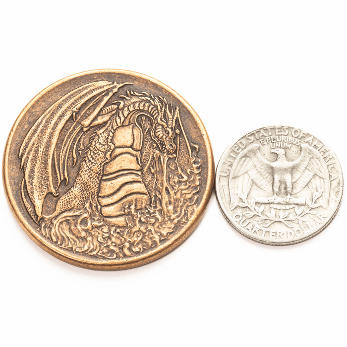 Fire & Ice Dragon and Hydra collectible coin, shown with quarter for size comparison