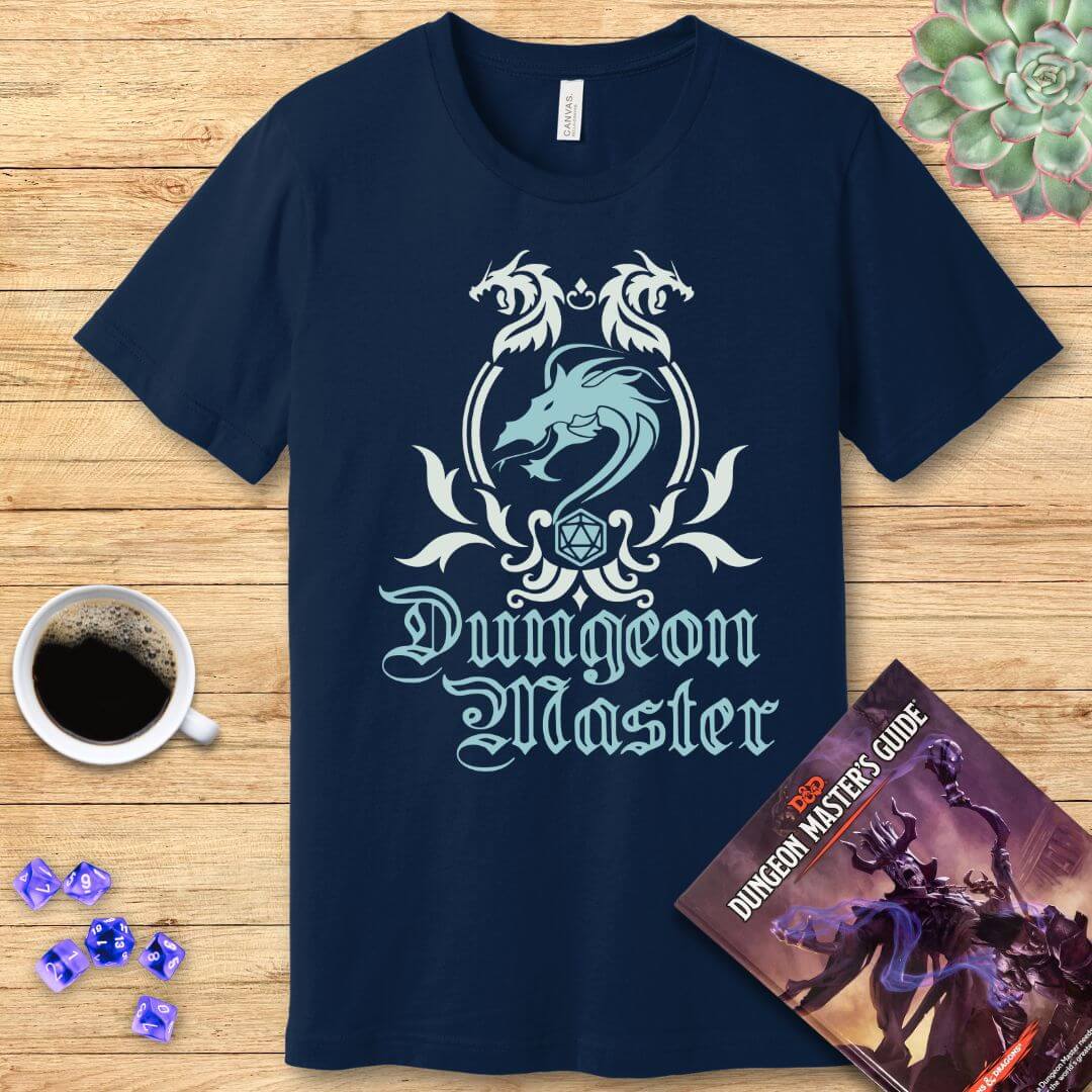 Navy blue t-shirt with 'Dungeon Master' design on a wooden surface with coffee and dice.