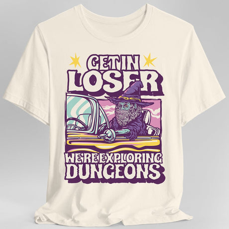 Off white t-shirt with a graphic design featuring a wizard in a car and text 'Get in loser, we're exploring dungeons'