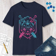 Navy blue t-shirt with a D20 dice design, swords, and pink and blue colors on a wooden surface.