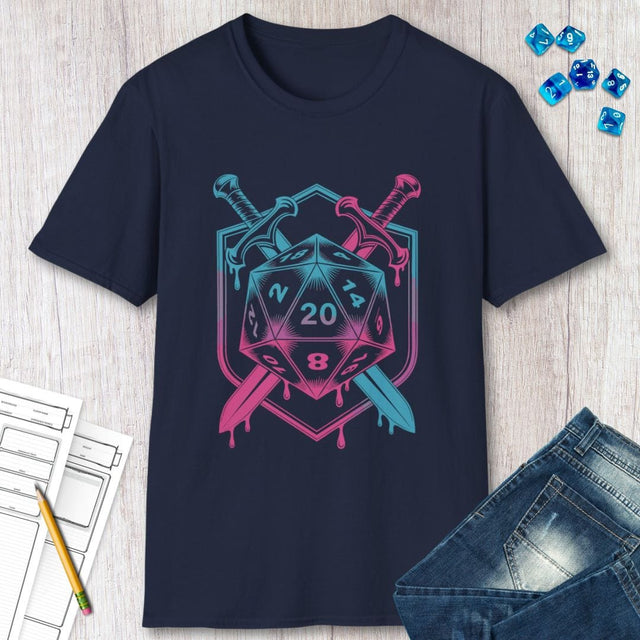 Navy blue t-shirt with a D20 dice design, swords, and pink and blue colors on a wooden surface.