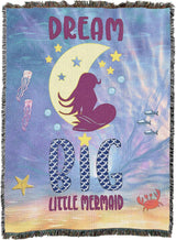 Tapestry blanket with mermaid on moon and the text "Dream Big Little Mermaid"