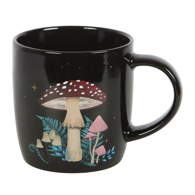 Black mug with mushroom design on a white background