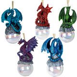 Set of five dragon-themed Christmas ornaments on glass orbs