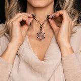 Seal of Solomon pendant necklace with red accents, shown worn
