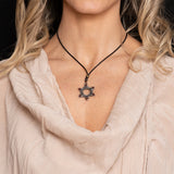 Seal of Solomon pendant necklace with red accents, shown worn
