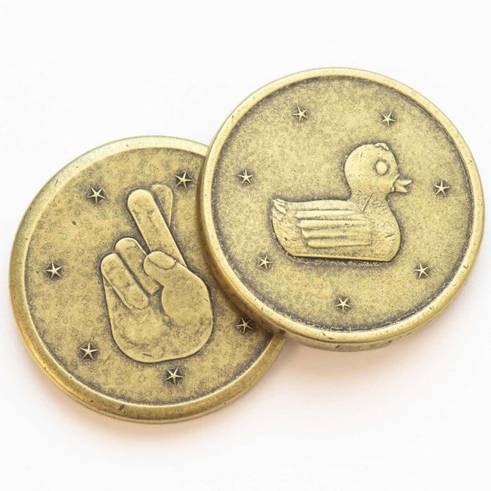 Brass collectible lucky duck coin with duck on one side and crossed fingers on the other