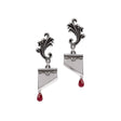 Pair of earrings shaped like guillotines with crystal blood droplets