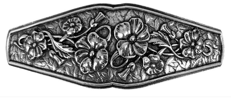 Pewter barrette with flowers across it