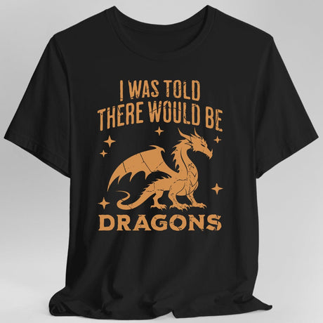 Black t-shirt with orange dragon graphic and text reading "I was told there would be dragons"