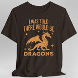Brown t-shirt with orange dragon graphic and text reading "I was told there would be dragons"