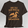 Brown t-shirt with orange dragon graphic and text reading "I was told there would be dragons"