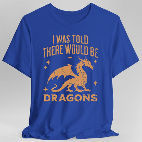 Blue t-shirt with orange dragon graphic and text reading "I was told there would be dragons"