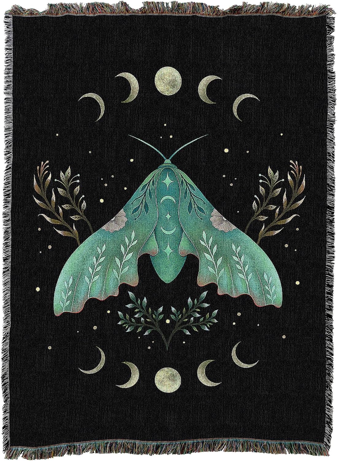 A black woven throw blanket with fringe edges, featuring a large teal-green moth surrounded by cream-colored crescent moons, stars, and botanical motifs.