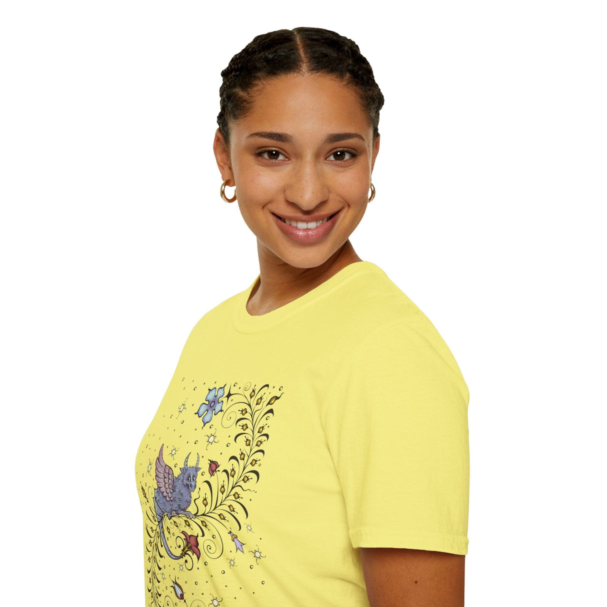 Lady wearing yellow t-shirt with a medieval manuscript dragon and floral design