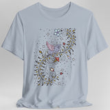 Light blue t-shirt with a medieval manuscript dragon and floral design