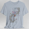 Light blue t-shirt with a medieval manuscript dragon and floral design