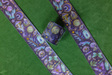 Decorative washi tape with witchy designs on purple and gold foil accents