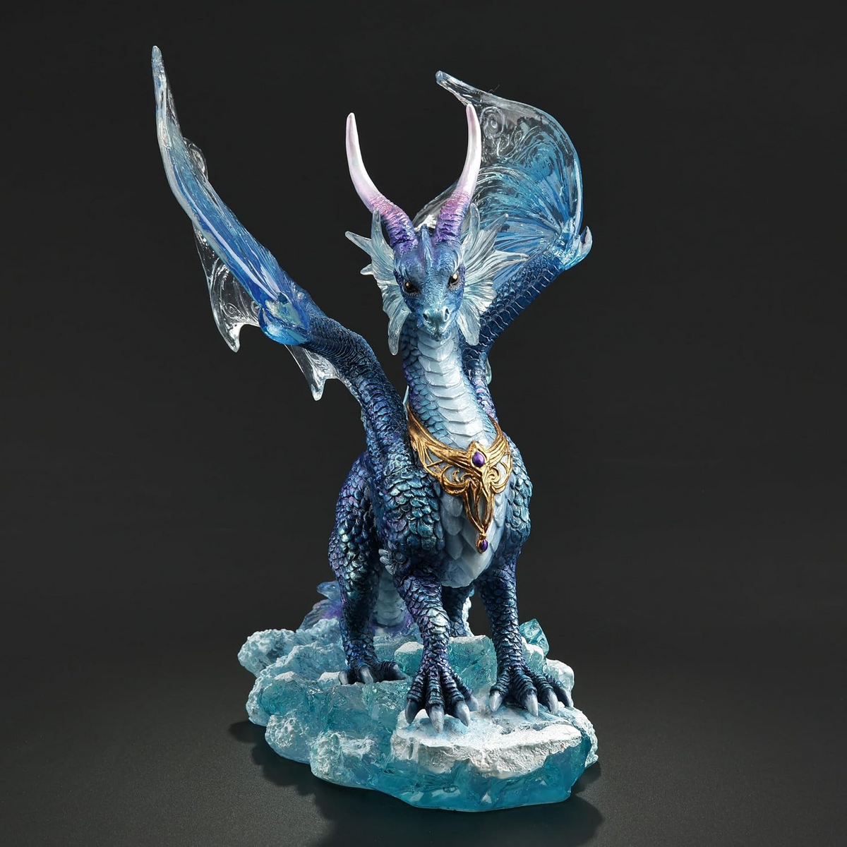 Figurine of blue dragon standing in the ocean waves