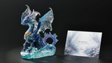 Figurine of blue dragon standing in the ocean waves with info card