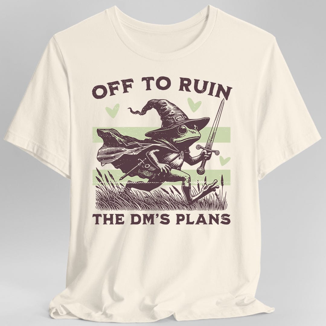 Cream T-shirt with a graphic of a frog in a wizard hat holding a sword, text 'Off to ruin the DM's plans'