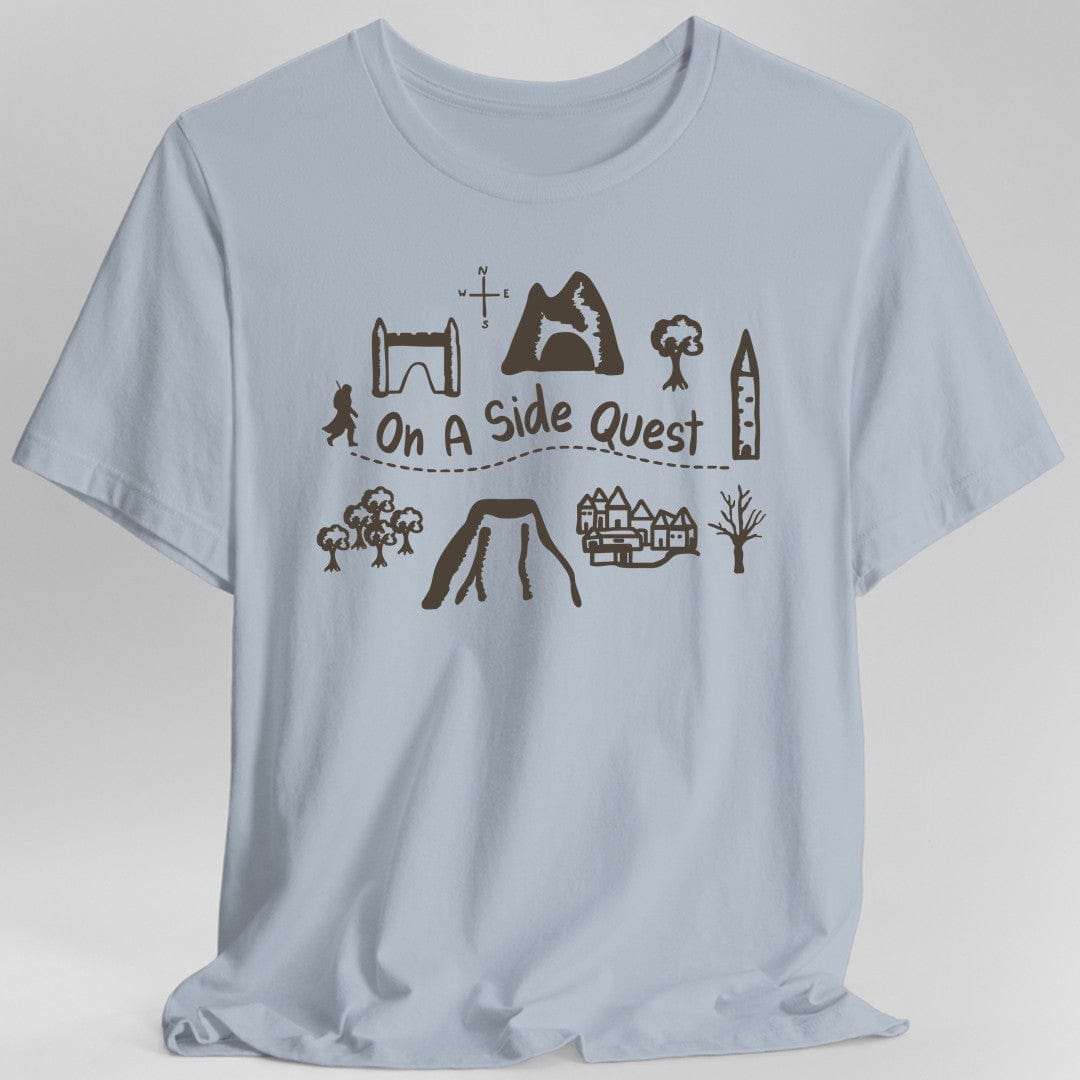 Light blue t-shirt with adventuring graphics and the phrase "On A Side Quest"
