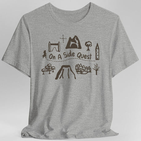 Gray t-shirt with adventuring graphics and the phrase "On A Side Quest"