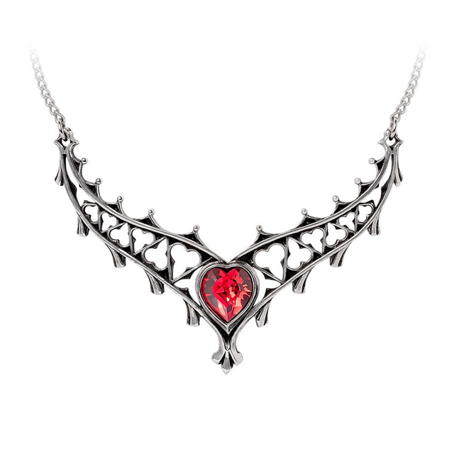 Necklace with a heart-shaped red gem and intricate pewter design on a white background