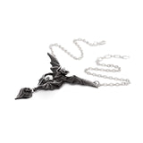 Bat-shaped pendant on a chain against a white background