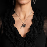 Pewter skull teapot with crystal drip pendant necklace, shown worn