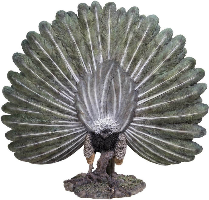 Back of detailed peacock statue showing feathers