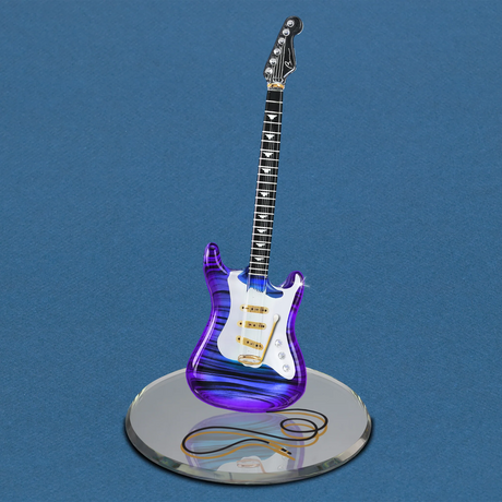 Glass figurine of purple and white guitar