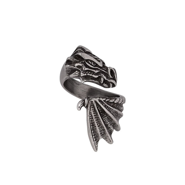 Silver dragon head and wing ring on a white background